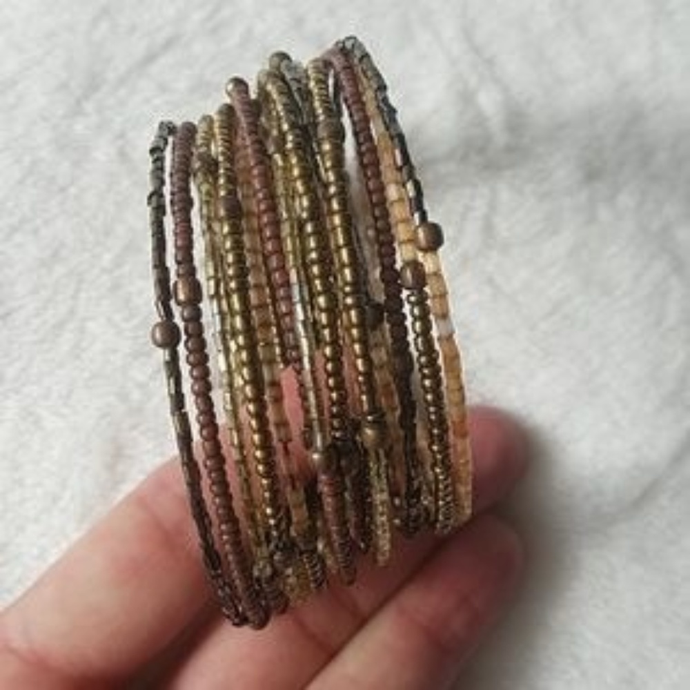 2 Bracelets (one brown; one pink)
